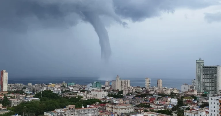 Marine tornado forming over Havana Malecón waters under tropical sky and sunlight, 2025