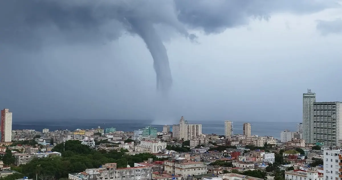 Marine tornado forming over Havana Malecón waters under tropical sky and sunlight, 2025