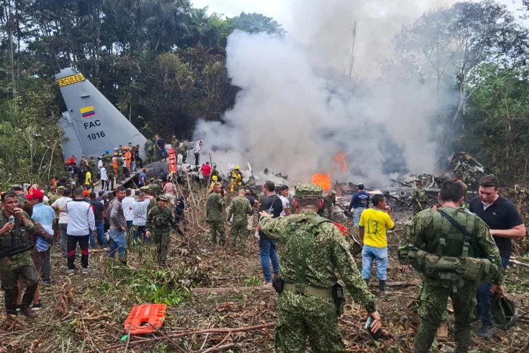 Rescue teams work at the crash site in Putumayo following a military aircraft accident.