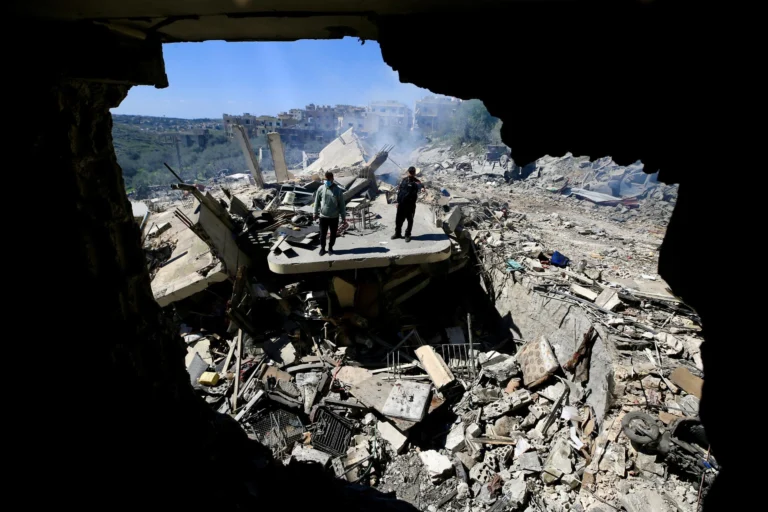 People walk amongst the rubble of a building targeted in an Israeli airstrike in Sir el-Gharbiyeh, south Lebanon, 08 March 2026 leaving at least 17 people killed and 7 others injured. The Israeli military stated it is conducting strikes across the country targeting Hezbollah infrastructure and personnel. According to the Lebanese Ministry of Public Health, at least 394 people were killed and 1160 others injured in airstrikes across Beirut's southern suburbs and villages in southern Lebanon. Photo: EFE.