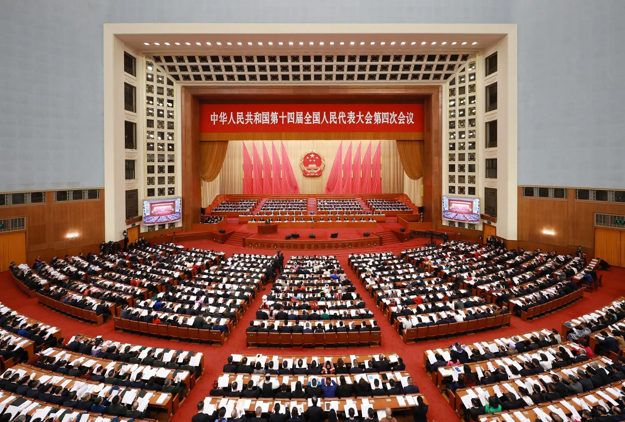 Delegates attend the opening session of China’s top political advisory body at the Great Hall of the People in Beijing.