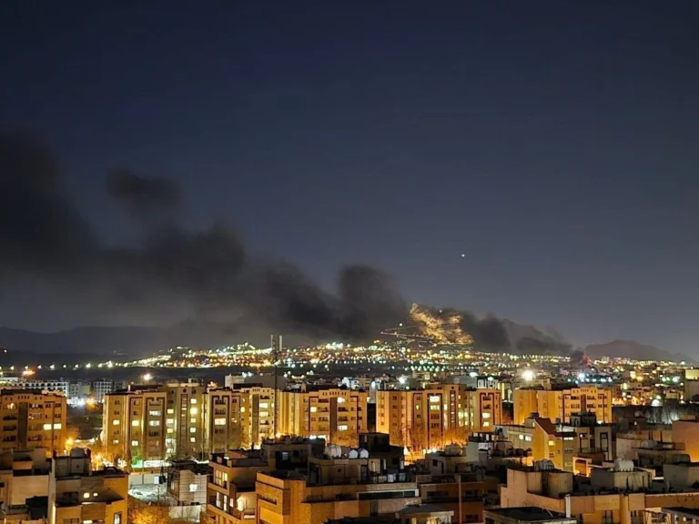 Damage reported at schools and nearby homes after missile strikes in Parand, Iran.