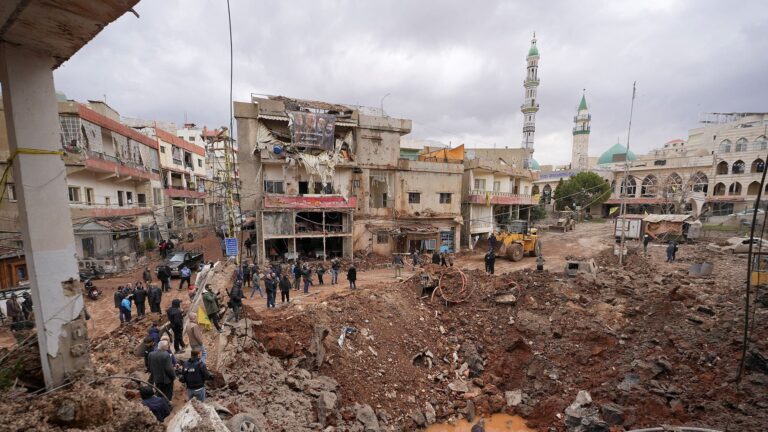 Iran War Day 15 captured through smoke over Kharg Island after US strikes on oil facilities.
