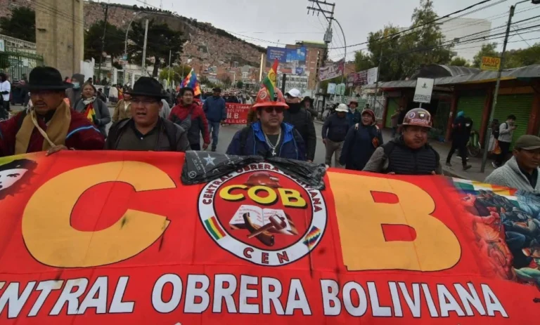 Bolivia blockades on a highway with stranded trucks