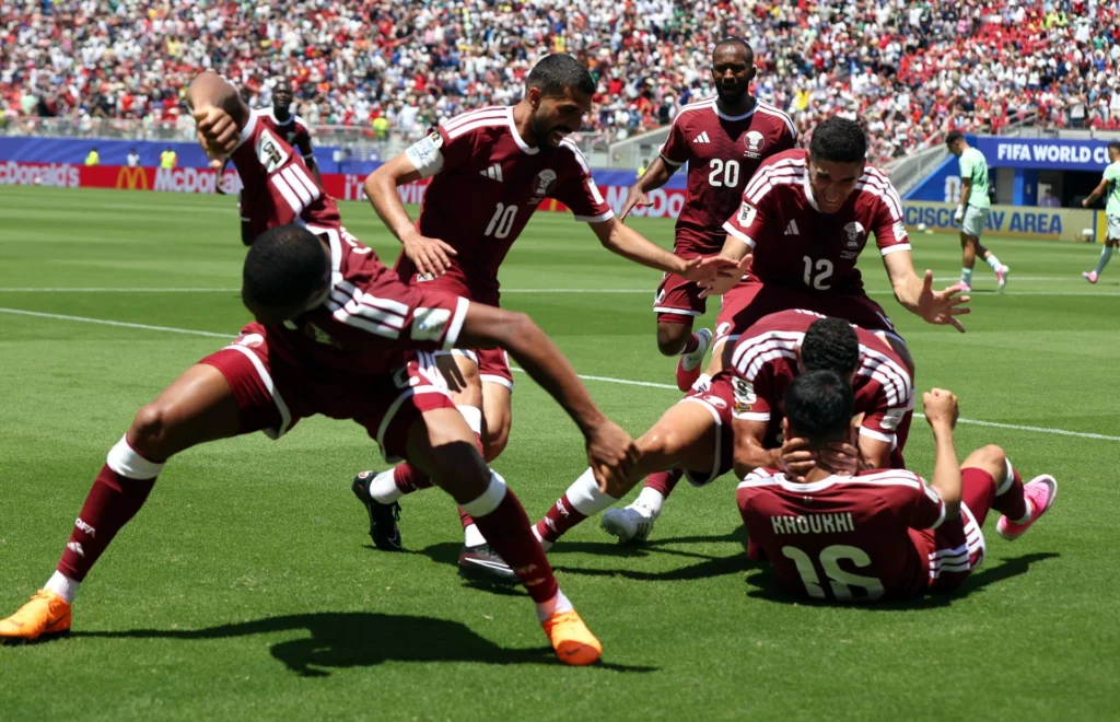 Boualem Khoukhi of Qatar (down-R) celebrates scoring the 1-1 with teammates during the FIFA World Cup 2026 group stage match Qatar against Switzerland, in San Francisco, USA, 13 June 2026. (Photo: EFE/EPA/BENJAMIN FANJOY).