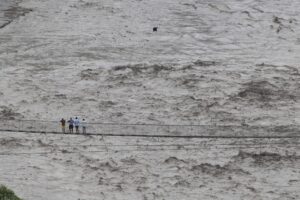 Rescue teams working amid flooding, landslides and heavy rain in Nepal after a deadly flood disaster.