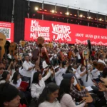 Chileans gather with guitars and photographs to commemorate Víctor Jara outside Santiago’s General Cemetery.