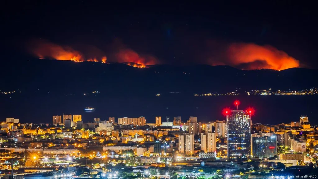 Rescue boats evacuate people from Brač island during a wildfire near Milna, Croatia