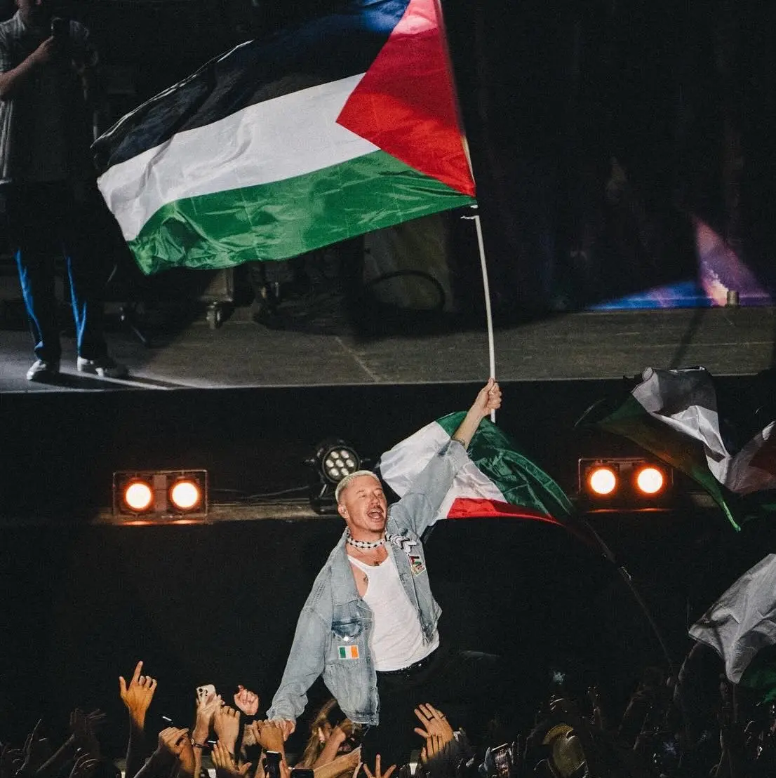 Macklemore performs on stage during Ed Sheeran’s Loop Tour amid controversy over his pro-Palestine remarks.