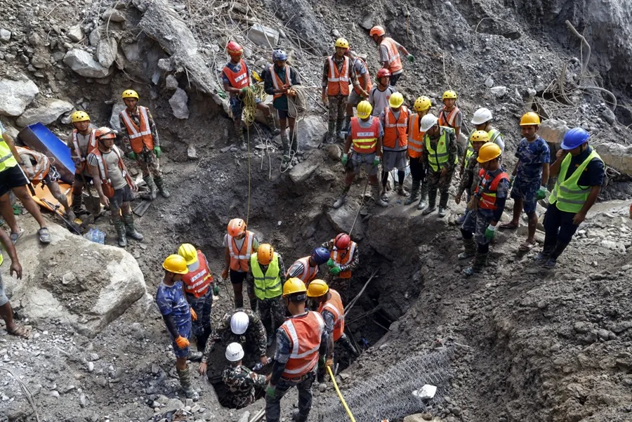 Nepal rescue teams search the Trishuli 3A hydropower tunnel for workers trapped after floods.