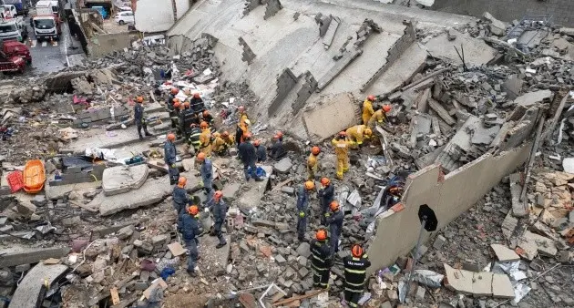 Emergency crews search debris after a 12-story building collapsed in São Paulo, Brazil, amid heavy rains.