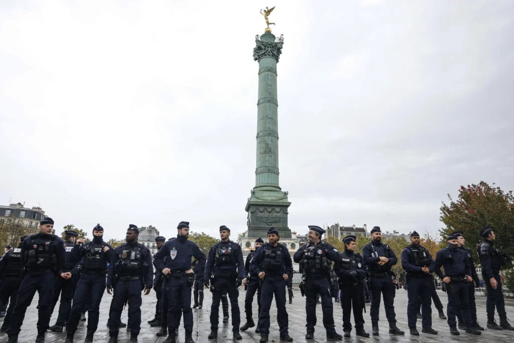 Businesses board up shopfronts in Paris ahead of protests in France as authorities deploy 70,000 police officers and gendarmes.