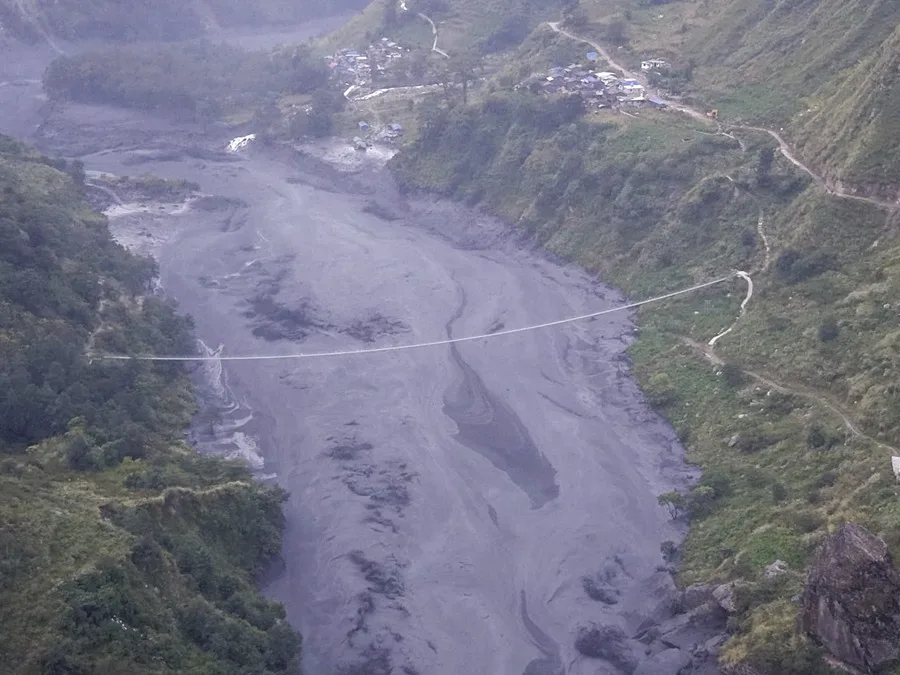 Flood damage in Nepal’s Gorkha province after a sudden river surge destroyed homes and bridges.